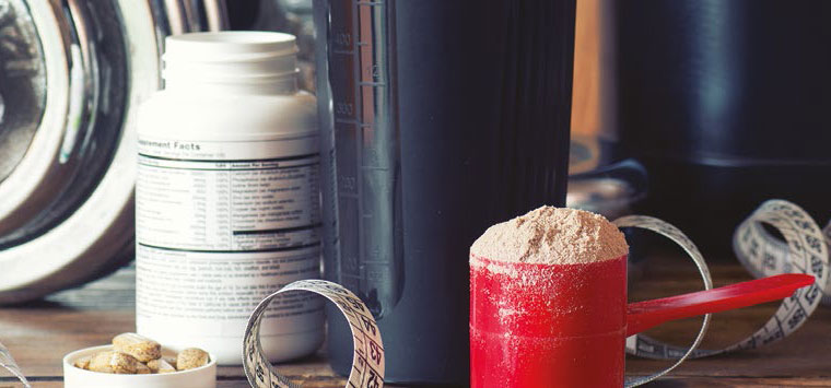 Supplement powder next to some weights.